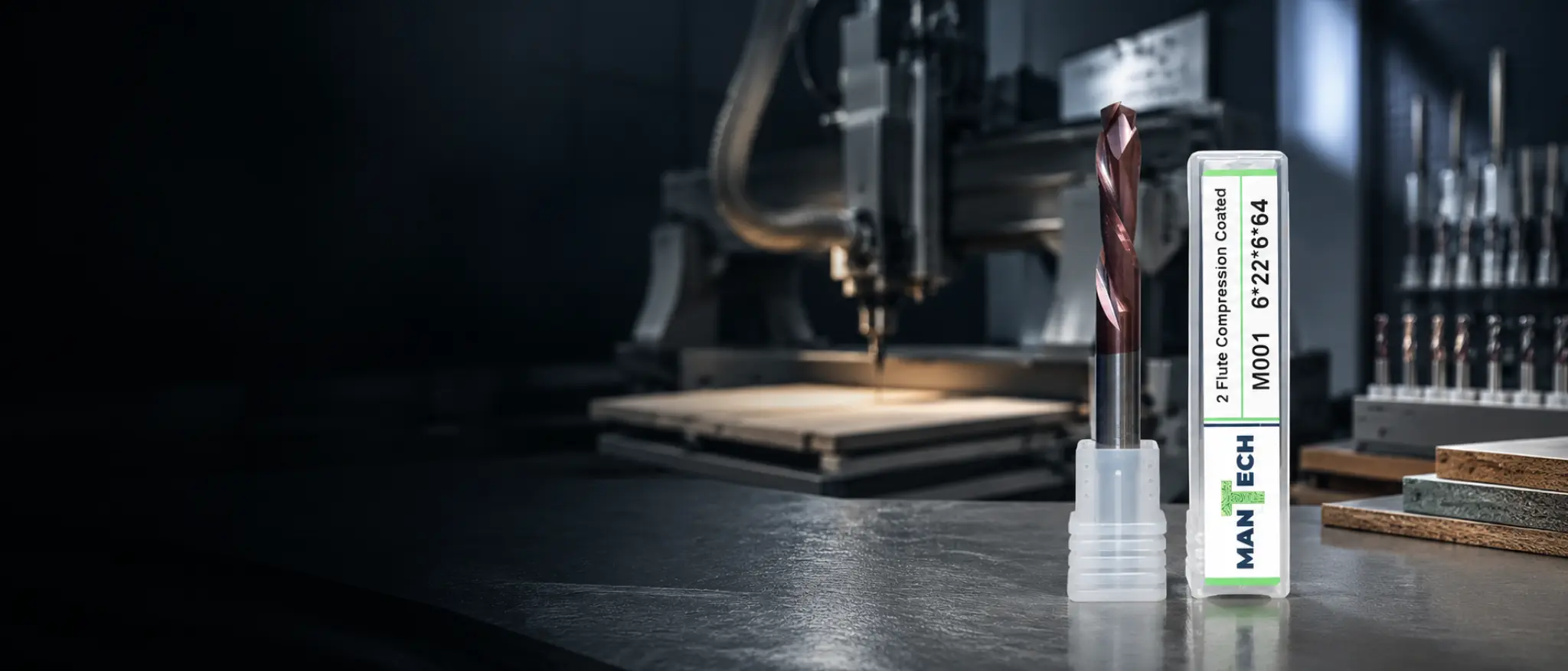 Mantech compression cutter beside a CNC router and tooling rack